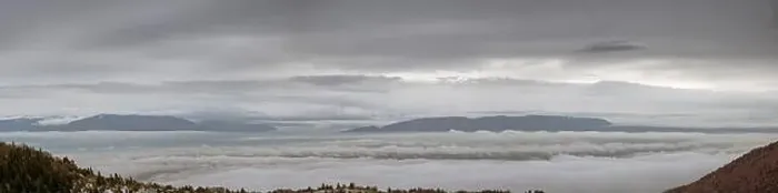 Framed Print : A cloudy, misty landscape can be seen rising through the low clouds Framed Print : A cloudy, misty landscape can be seen rising through the low clouds