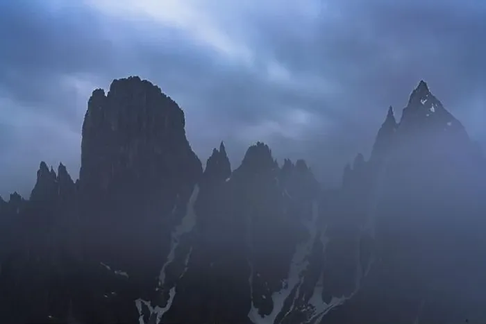 Framed Print : Cloudy sky at dusk over Cadini di Misurina emerging from fog, Dolomites, Veneto, Italy