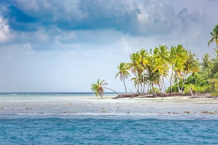 Framed Print : Cloudy tropical island coast or shoreline, palm trees and storm clouds with wavey sea or ocean water. Exotic destination island coastline Framed Print : Cloudy tropical island coast or shoreline, palm trees and storm clouds with wavey sea or ocean water. Exotic destination island coastline