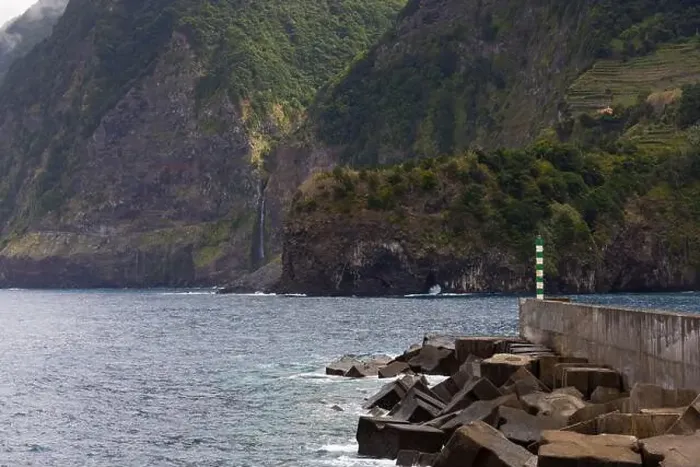 Framed Print : Coastline with big cliffs of Seixal and the Port with the Veu da Noiva waterfall in the background Framed Print : Coastline with big cliffs of Seixal and the Port with the Veu da Noiva waterfall in the background