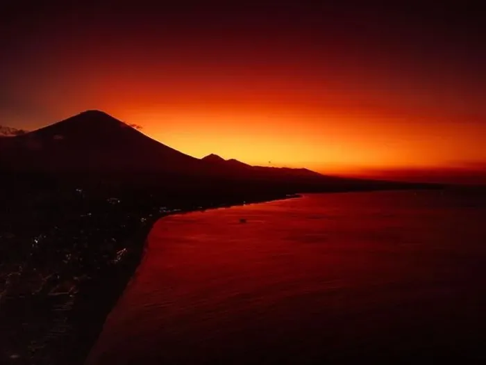 Framed Print : Coastline with sunset or sunrise and quiet ocean in Bali. Silhouette of coastline with Agung volcano Framed Print : Coastline with sunset or sunrise and quiet ocean in Bali. Silhouette of coastline with Agung volcano