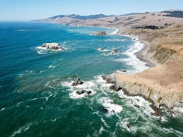 The cold Pacific Ocean washes against the rugged and wild Sonoma coastline in northern California