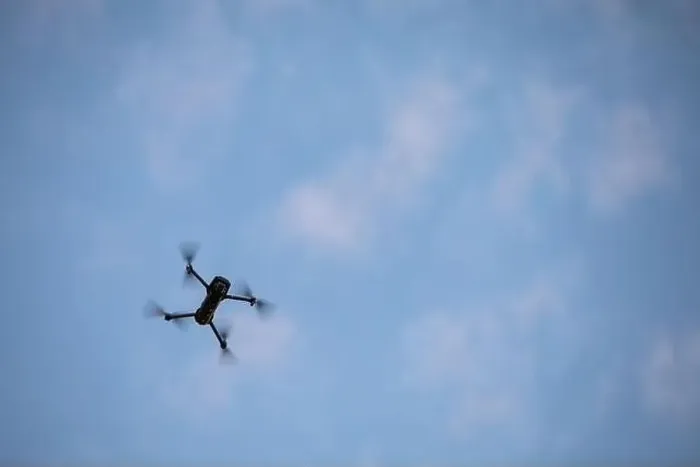 Framed Print : Color image of a drone flying at sunrise
