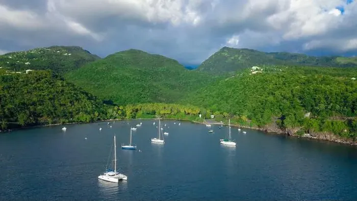 Framed Print : Colorful Bay with the Small Boats among the Green Mountains, Guadeloupe island Framed Print : Colorful Bay with the Small Boats among the Green Mountains, Guadeloupe island