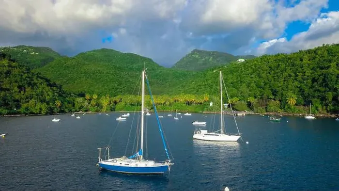 Framed Print : Colorful Bay with the Small Boats among the Green Mountains, Guadeloupe island Framed Print : Colorful Bay with the Small Boats among the Green Mountains, Guadeloupe island