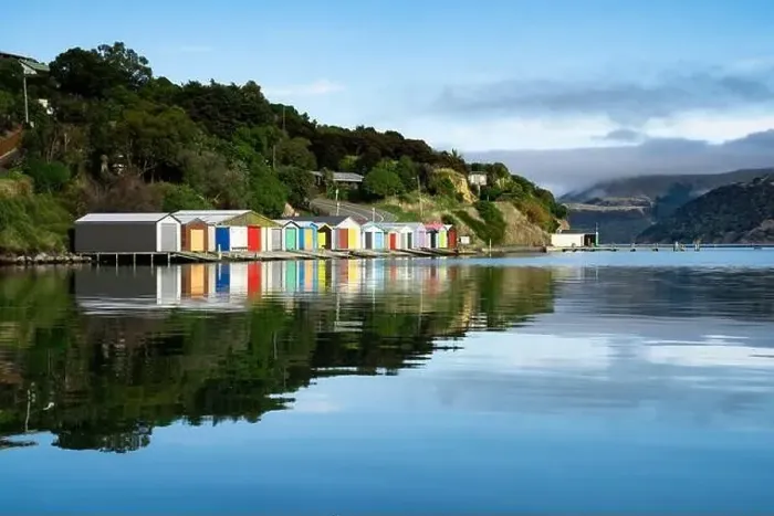 Framed Print : Colorful Boat Sheds with beautiful reflection on daytime at Duvauchelle Framed Print : Colorful Boat Sheds with beautiful reflection on daytime at Duvauchelle