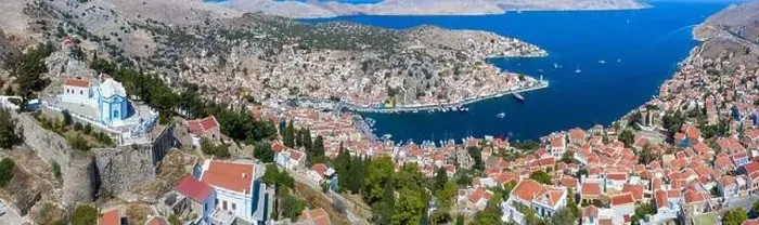 Framed Print : Colorful houses village in Symi island, Dodecanese islands, Greece Framed Print : Colorful houses village in Symi island, Dodecanese islands, Greece