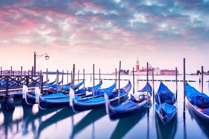 Framed Print : Colorful landscape with pink sunset sky on piazza San Marco in Venice. Row of gondolas parked on city pier Framed Print : Colorful landscape with pink sunset sky on piazza San Marco in Venice. Row of gondolas parked on city pier