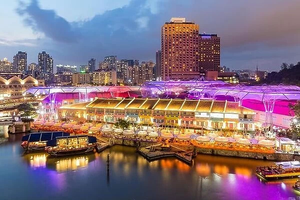 Colorful light building at night in Clarke Quay, Singapore. Clarke Quay, is a historical riverside quay in Singapore