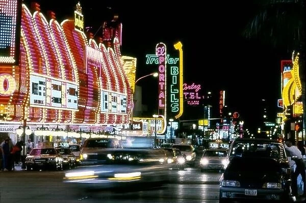 Colorful neon signs at night on Fremont Street in Downtown Las Vegas, Nevada circa 1970s