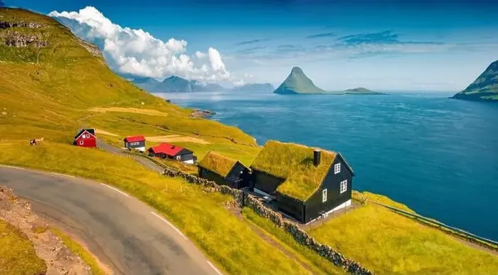 Framed Print : Colorful summer view from flying drone of Velbastadur village with typical turf-top houses Framed Print : Colorful summer view from flying drone of Velbastadur village with typical turf-top houses
