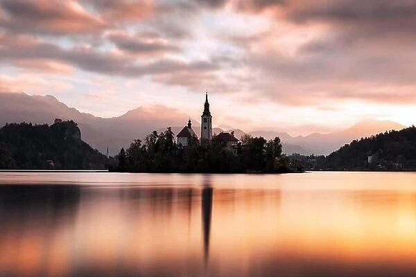 Colorful sunrise view of Bled lake in Julian Alps, Slovenia. Pilgrimage church of the Assumption of Maria on a foreground. Landscape photography