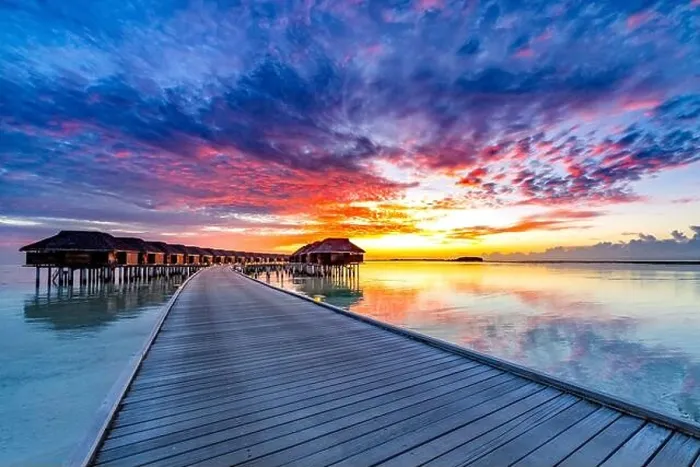 Framed Print : Colorful sunset over ocean on Maldives. Maldives island sunset. Water bungalows resort at islands beach. Indian Ocean, Maldives. Amazing travel scene Framed Print : Colorful sunset over ocean on Maldives. Maldives island sunset. Water bungalows resort at islands beach. Indian Ocean, Maldives. Amazing travel scene