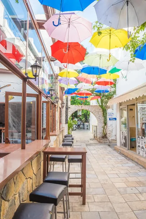 Framed Print : Colorful umbrellas hanging down at narrow streets of Bodrum with white houses in Greek style Bodrum Framed Print : Colorful umbrellas hanging down at narrow streets of Bodrum with white houses in Greek style Bodrum