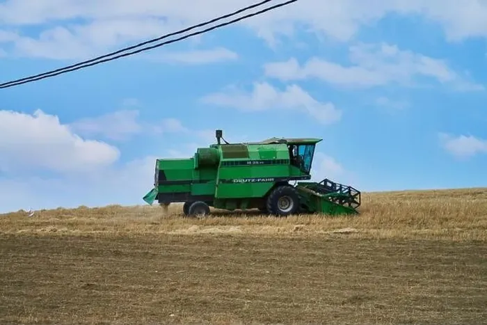 Framed Print : combine harvester working on a field Framed Print : combine harvester working on a field