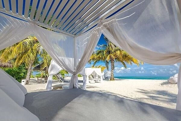 Comfortable lounge canopy on VIP beach seascape. Design of tourism for summer vacation holiday destination concept. Beach canopy, luxury landscape