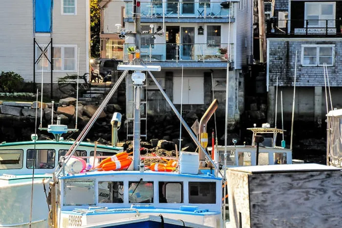 Framed Print : Compressed view of a few old, traditional lobster boats against work buildings on a bright summer day Framed Print : Compressed view of a few old, traditional lobster boats against work buildings on a bright summer day
