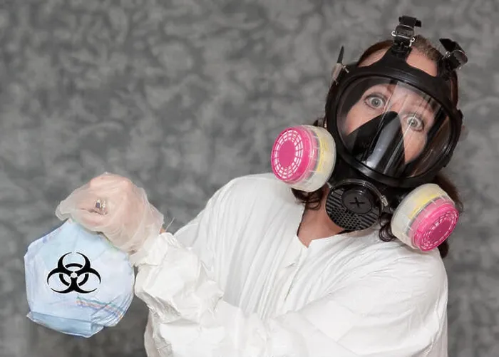 Framed Print : Concerned Woman with Gas Mask, gloves and Lab Coat holding Trash with Bio Hazard Symbol Framed Print : Concerned Woman with Gas Mask, gloves and Lab Coat holding Trash with Bio Hazard Symbol