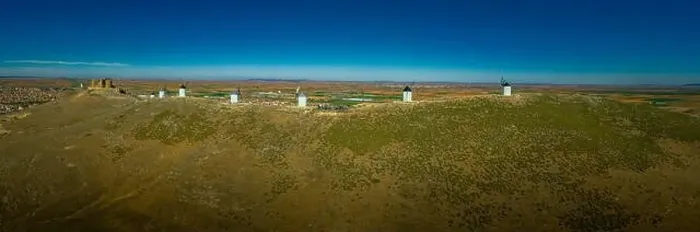 Framed Print : Consuegra castle and windmills aerial view with blue sky in La Mancha Spain famous Don Quixote site aerial panorama Framed Print : Consuegra castle and windmills aerial view with blue sky in La Mancha Spain famous Don Quixote site aerial panorama