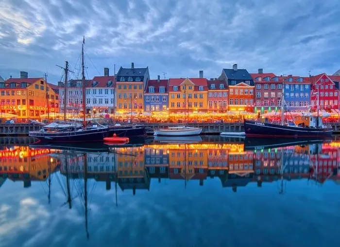 Framed Print : Copenhagen, Denmark - July 02, 2021: Copenhagen iconic view. Famous old Nyhavn port in the center of Copenhagen, Denmark during summer night
