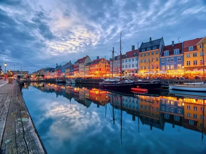 Framed Print : Copenhagen, Denmark - July 02, 2021: Famous old Nyhavn port in the center of Copenhagen, Denmark during summer night. Copenhagen iconic view Framed Print : Copenhagen, Denmark - July 02, 2021: Famous old Nyhavn port in the center of Copenhagen, Denmark during summer night. Copenhagen iconic view