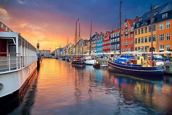 Copenhagen, Nyhavn Canal. Image of Nyhavn Canal in Copenhagen, Denmark during beautiful sunset