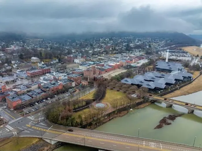 Framed Print : Corning, NY, USA - 03-02-2024 - Cloudy winter aerial image of the downtown area in the City of Corning