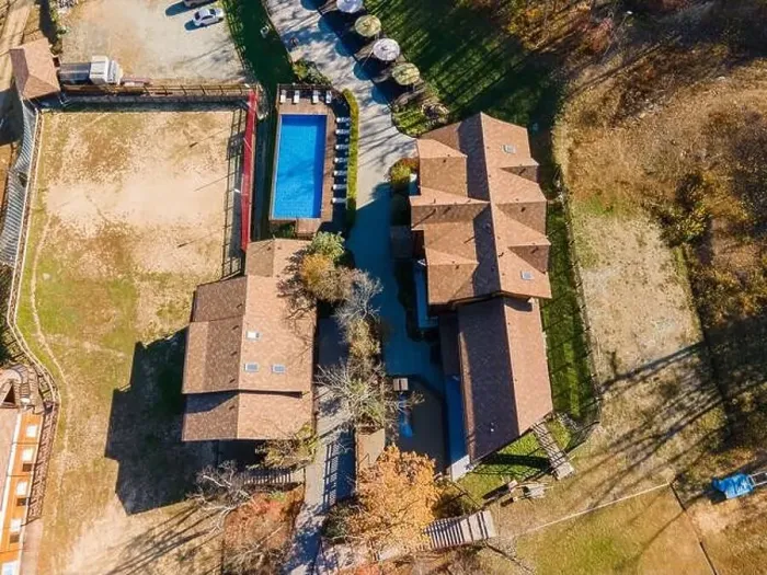 Framed Print : Country recreation center located in the woods with a large blue pool, sun loungers and tables. Photo from the drone Framed Print : Country recreation center located in the woods with a large blue pool, sun loungers and tables. Photo from the drone