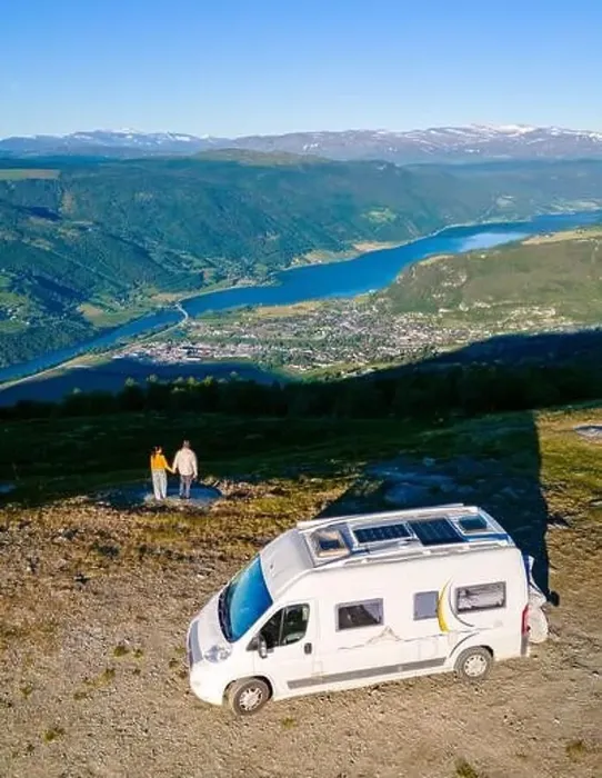 Framed Print : A couple enjoys the view of a Norwegian fjord from their campervan Framed Print : A couple enjoys the view of a Norwegian fjord from their campervan