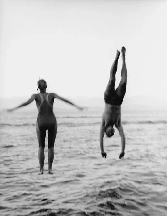 Framed Print : Couple Jumping and Diving into Water Framed Print : Couple Jumping and Diving into Water