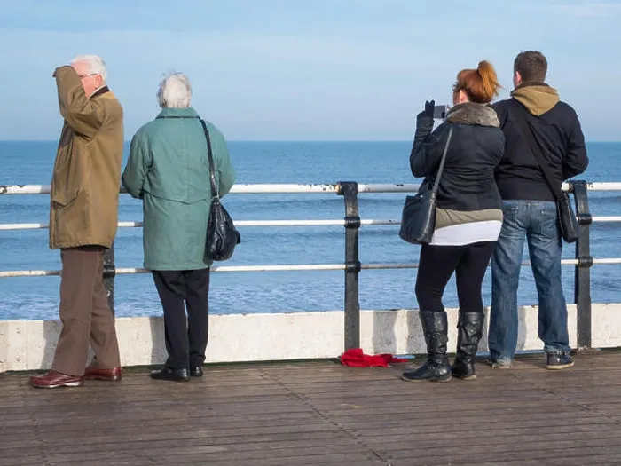 Framed Print : Two couples, young and old, on the end of Saltburn pier enjoying the view in warm winter sunshine Framed Print : Two couples, young and old, on the end of Saltburn pier enjoying the view in warm winter sunshine