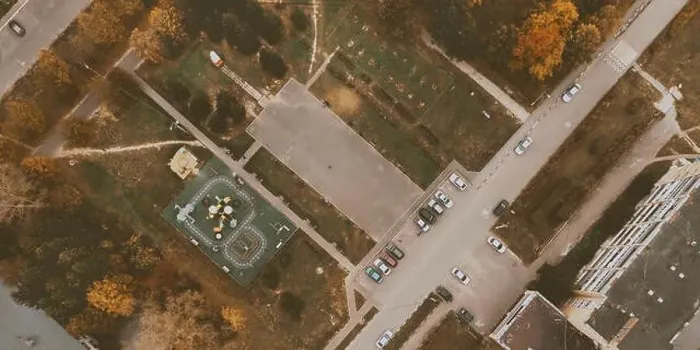 Framed Print : Courtyard of small town with children playground, parking with cars, green lawn and roads. Drone view. Banner background Framed Print : Courtyard of small town with children playground, parking with cars, green lawn and roads. Drone view. Banner background