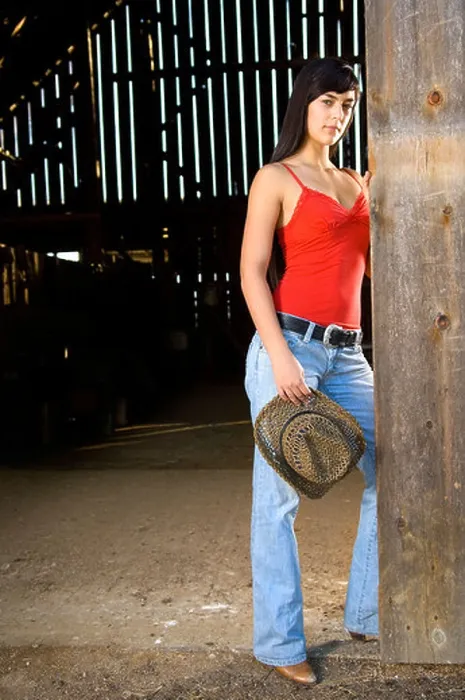 Framed Print : Cowgirl in barn doorway with hat and tank top Framed Print : Cowgirl in barn doorway with hat and tank top