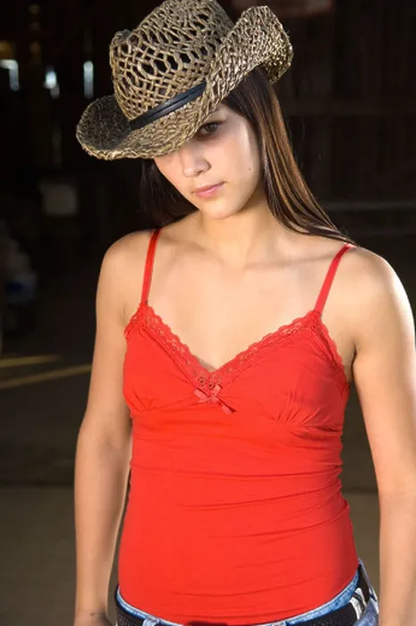 Framed Print : Cowgirl in barn doorway with hat and tank top Framed Print : Cowgirl in barn doorway with hat and tank top