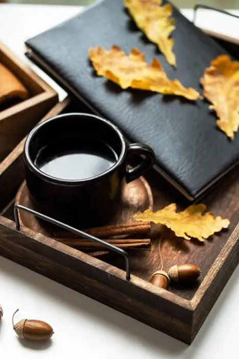 Framed Print : Cozy fall morning at home. Coffee cup, book and autumn leaves on wooden tray Framed Print : Cozy fall morning at home. Coffee cup, book and autumn leaves on wooden tray