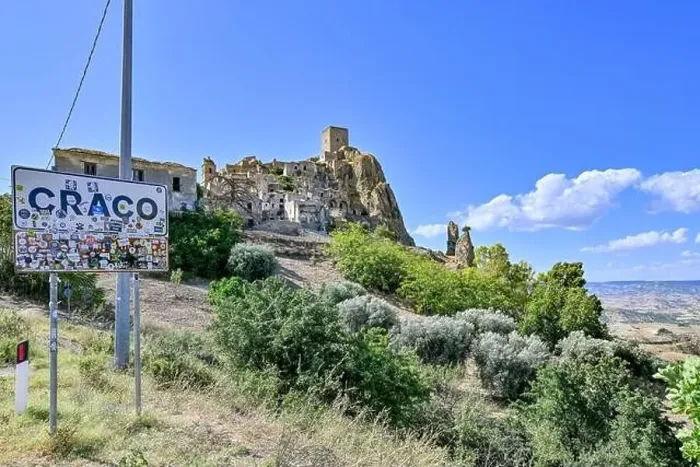 Framed Print : Craco, Italy - Aug 6, 2023: Sign at the entrance of the abandoned village of Craco, Basilicata region, Italy Framed Print : Craco, Italy - Aug 6, 2023: Sign at the entrance of the abandoned village of Craco, Basilicata region, Italy
