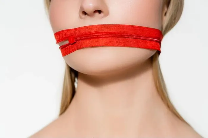 Framed Print : Cropped view of woman with red zipper on mouth isolated on grey Framed Print : Cropped view of woman with red zipper on mouth isolated on grey