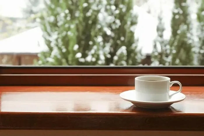 Framed Print : Cup of tea stands on wooden windowsill Framed Print : Cup of tea stands on wooden windowsill
