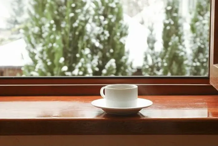 Framed Print : Cup of tea stands on wooden windowsill Framed Print : Cup of tea stands on wooden windowsill
