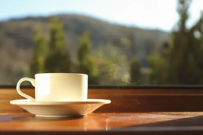 Framed Print : Cup of tea stands on wooden windowsill Framed Print : Cup of tea stands on wooden windowsill