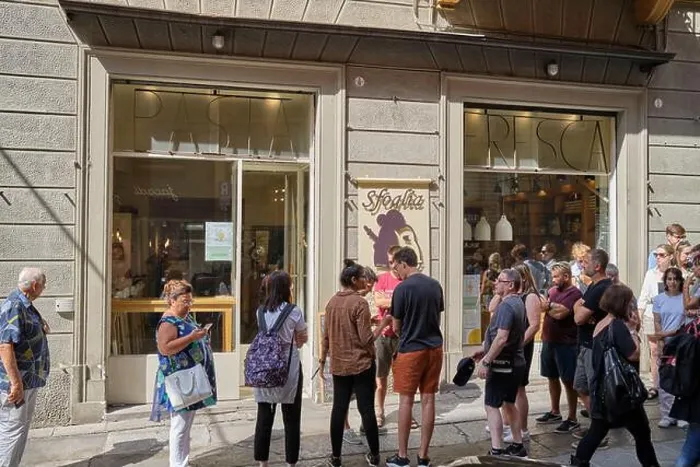 Framed Print : Customers waiting outside Sfoglia Reina Pasta Shop Restaurant in Bologna Italy Framed Print : Customers waiting outside Sfoglia Reina Pasta Shop Restaurant in Bologna Italy