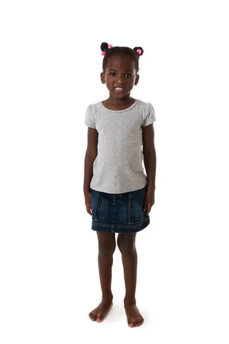 Framed Print : Cute African little girl standing barefoot, looking to the camera on white background Framed Print : Cute African little girl standing barefoot, looking to the camera on white background
