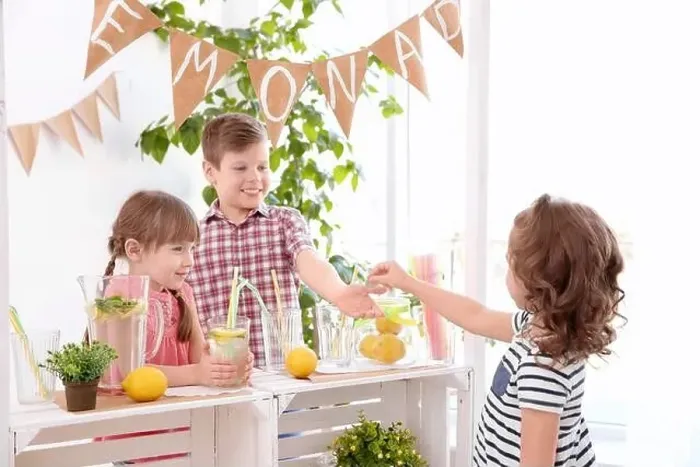 Framed Print : Cute little kids selling lemonade at counter Framed Print : Cute little kids selling lemonade at counter