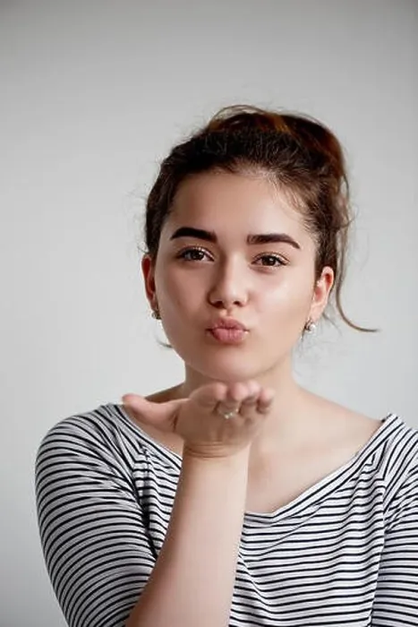 Framed Print : Cute lovely young woman standing and sending kiss over white background.Flying Kiss, Woman in Love Framed Print : Cute lovely young woman standing and sending kiss over white background.Flying Kiss, Woman in Love