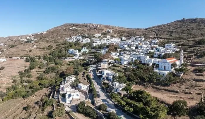 Framed Print : Cyclades, Greece. Tinos Greek island, aerial drone view of Kardiani village town, white color buildings, cloudy blue sky Framed Print : Cyclades, Greece. Tinos Greek island, aerial drone view of Kardiani village town, white color buildings, cloudy blue sky