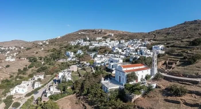 Framed Print : Cyclades, Greece. Tinos Greek island, aerial drone view of Kardiani village town, white color buildings, cloudy blue sky Framed Print : Cyclades, Greece. Tinos Greek island, aerial drone view of Kardiani village town, white color buildings, cloudy blue sky