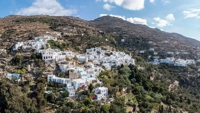 Framed Print : Cyclades, Greece. Tinos Greek island, aerial drone view of Kardiani village town, white color buildings, cloudy blue sky Framed Print : Cyclades, Greece. Tinos Greek island, aerial drone view of Kardiani village town, white color buildings, cloudy blue sky