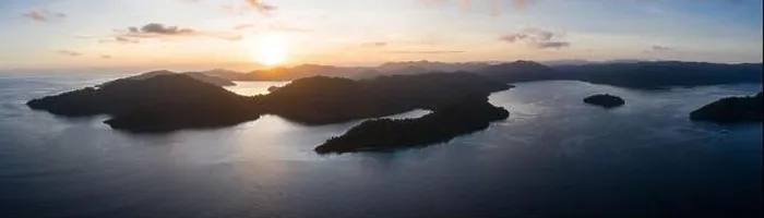 Framed Print : Dawn illuminates remote islands and the surrounding calm waters in Raja Ampat, Indonesia. This region is the epicenter of marine biodiversity Framed Print : Dawn illuminates remote islands and the surrounding calm waters in Raja Ampat, Indonesia. This region is the epicenter of marine biodiversity