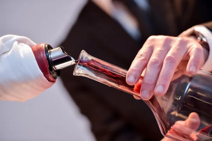 Framed Print : Decanting red wine - transferring wine to a carafe Framed Print : Decanting red wine - transferring wine to a carafe