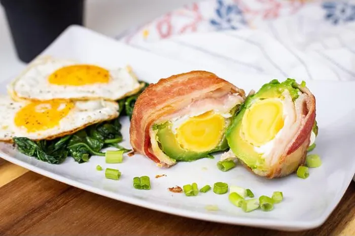 Framed Print : A delicious breakfast of eggs, bacon, and greens on a white square plate Framed Print : A delicious breakfast of eggs, bacon, and greens on a white square plate